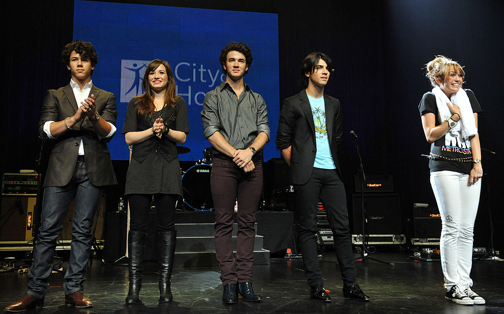 Nick Jonas, Demi Lovato, Kevin Jonas, Joe Jonas and Miley Cyrus attend the City of Hope Benefit Concert