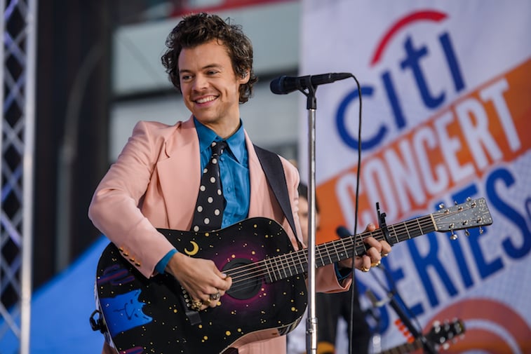Harry Styles performs music