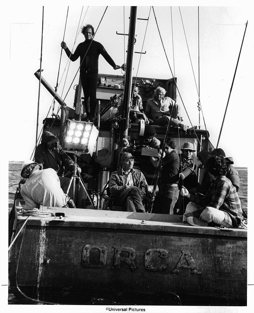 Roy Scheider on top deck as crew set up to film a scene from the film 'Jaws' 1975