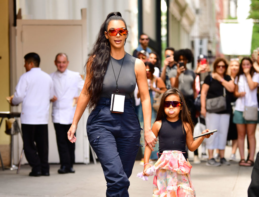 Kim Kardashian West and North West walking down the street