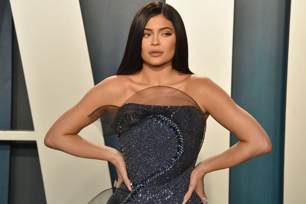 Kylie Jenner looking off camera with her hands on her hips