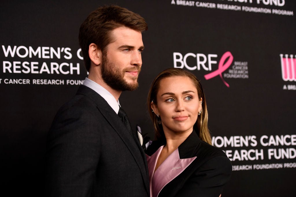 Liam Hemsworth and Miley Cyrus on the red carpet at an event in February 2019
