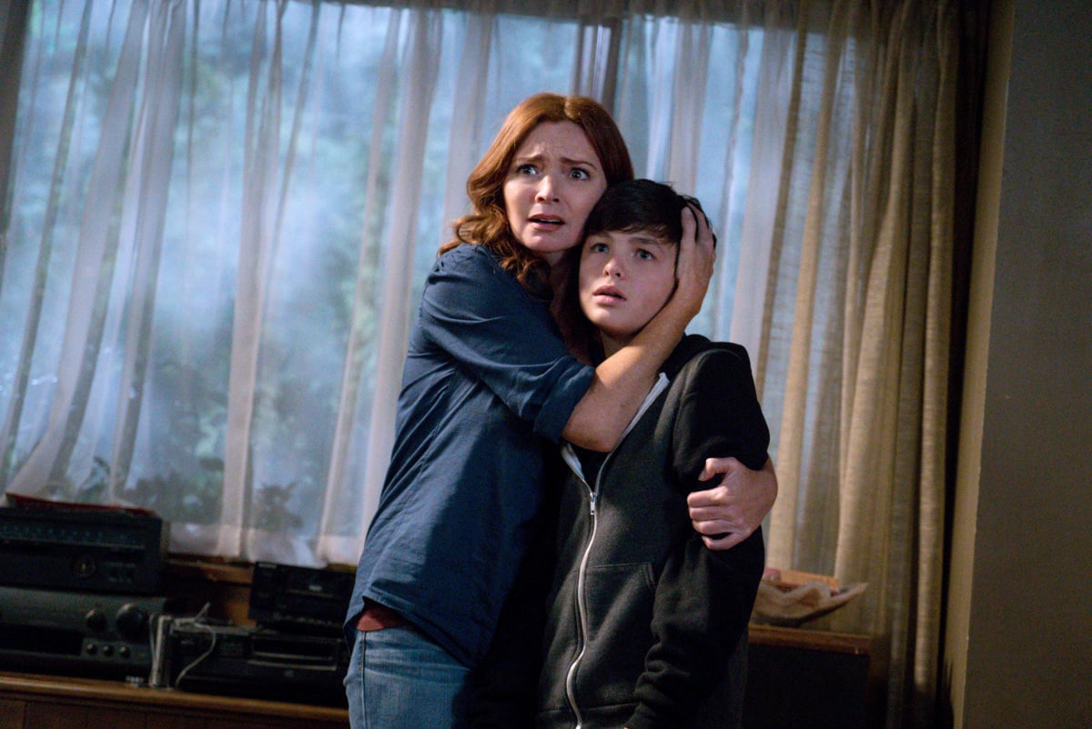 Brigid Brannagh with her arms around Logan Williams in 'Supernatural'