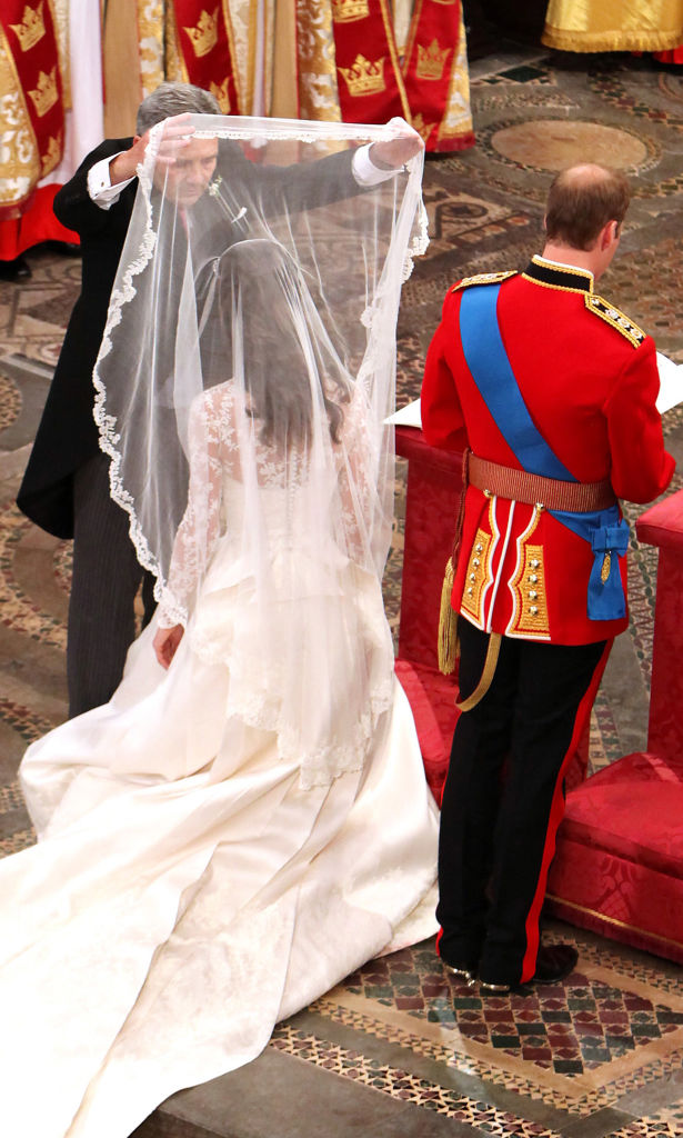 Michael Middleton lifts Kate Middleton's veil at her royal wedding to Prince William in 2011