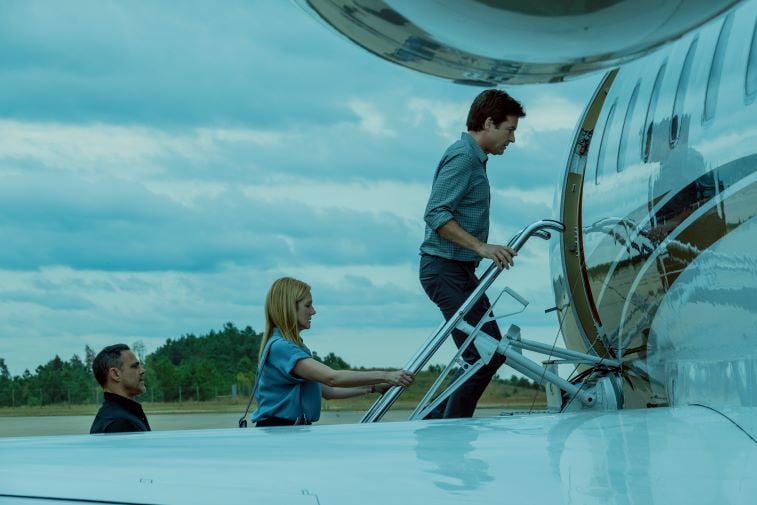 Jason Bateman and Laura Linney boarding a plane in 'Ozark' Season 3