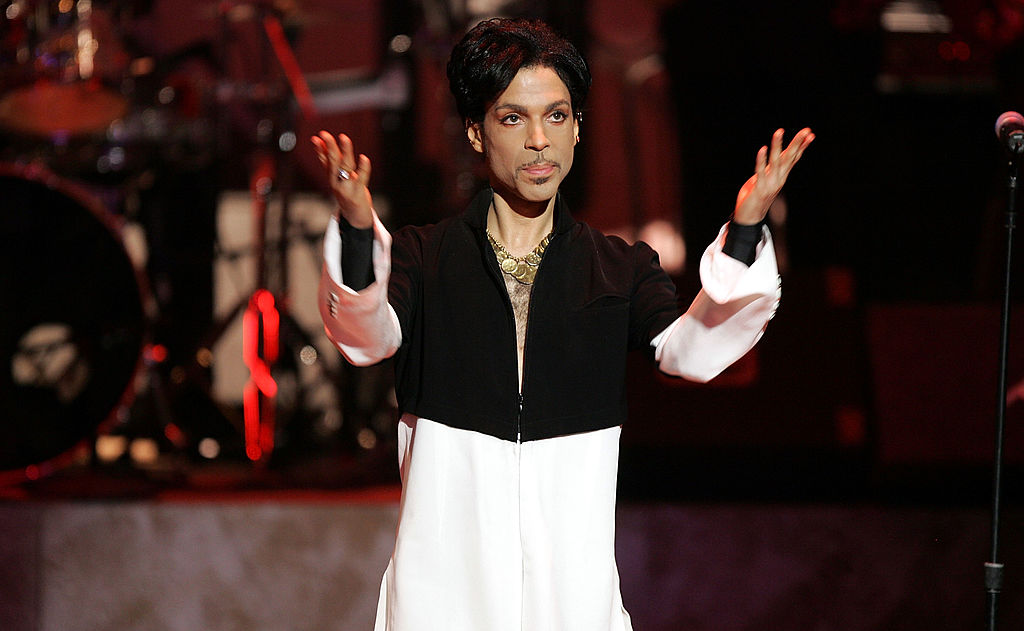 Prince stands onstage