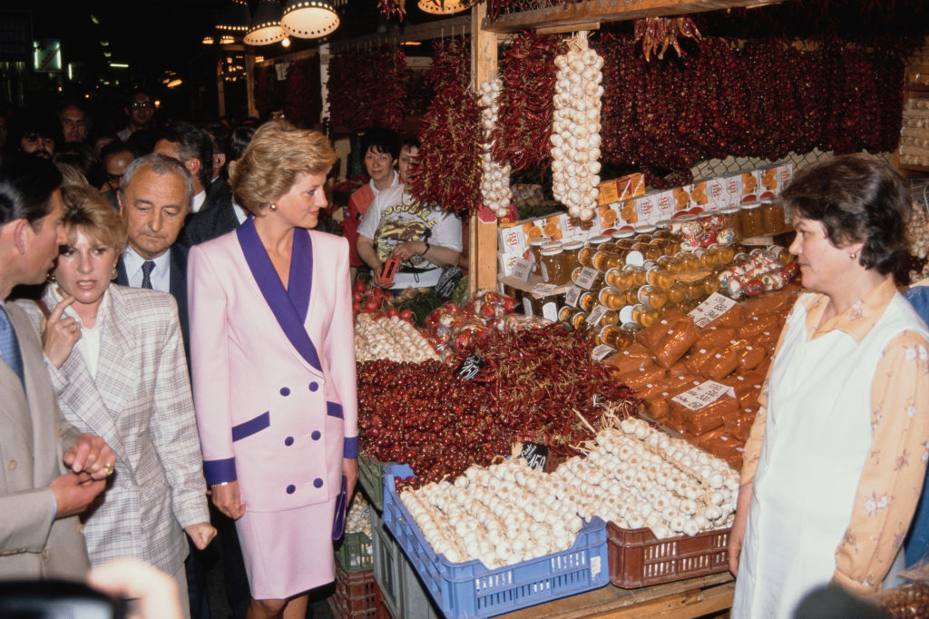 Prince Charles and Princess Diana walk through out a market in Hungary, 1990