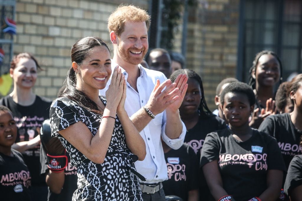 Prince Harry and Meghan, Duchess of Sussex arrive for a visit to the "Justice desk", an NGO in the township of Nyanga in Cape Town