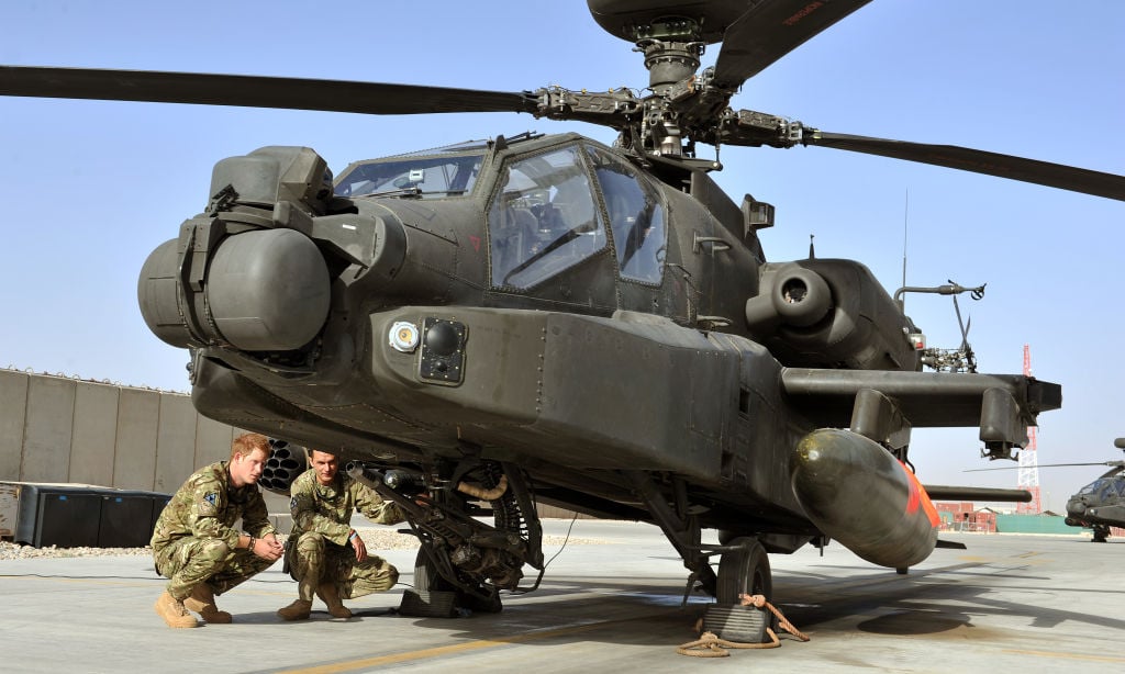 Prince Harry looks at an Apache helicopter on Sept. 7, 2012