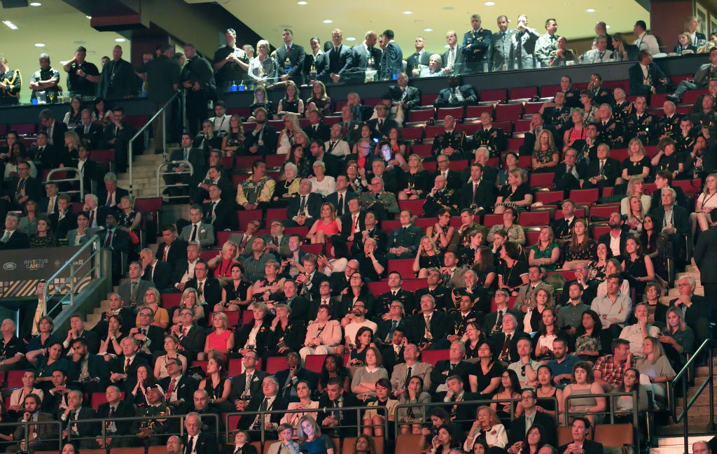 Prince Harry (far left) and Meghan Markle (far right) attend the 2017 Invictus Games opening ceremony.