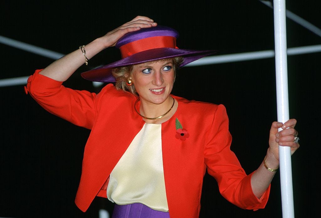 Princess Diana in a bold red and purple outfit