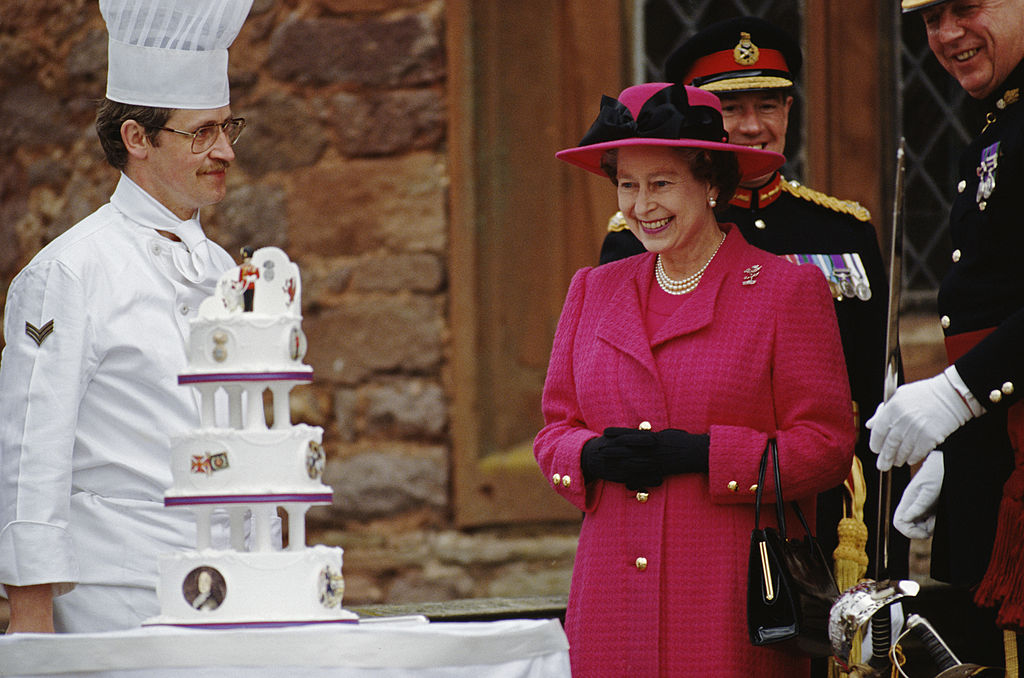 Queen Elizabeth II is presented with a birthday cake, 1989