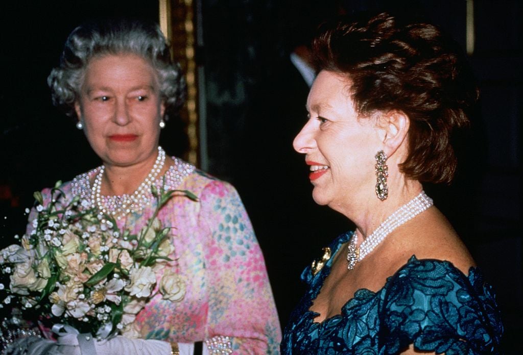 Queen Elizabeth II and Princess Margaret attend a charity concert 
