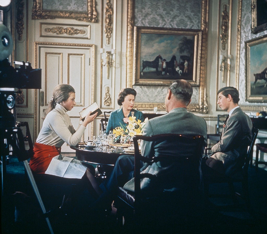 Queen Elizabeth II and Prince Philip having lunch with two of their children, Prince Charles and Princess Anne