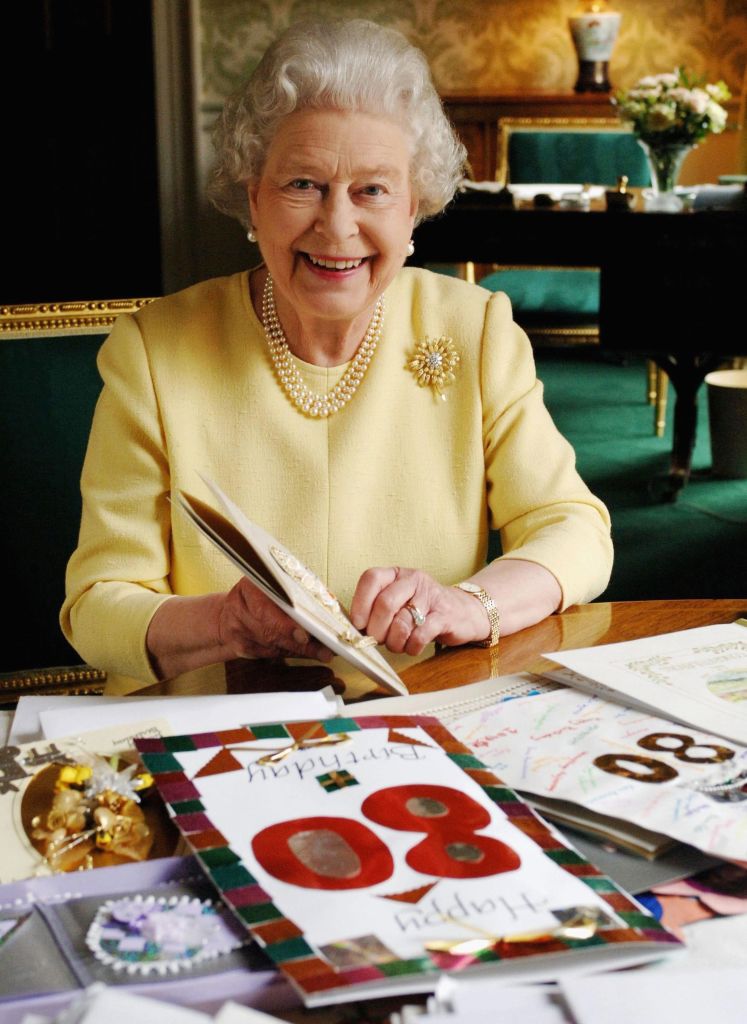 Queen Elizabeth II reads 80th birthday cards sent to her in 2006