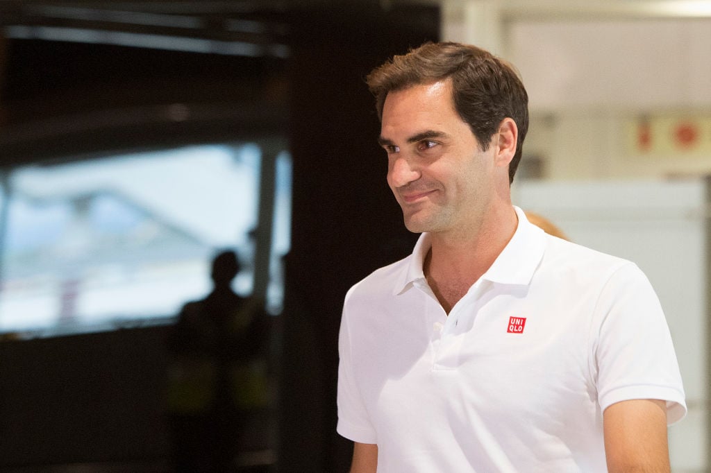 Roger Federer smiling, looking off camera