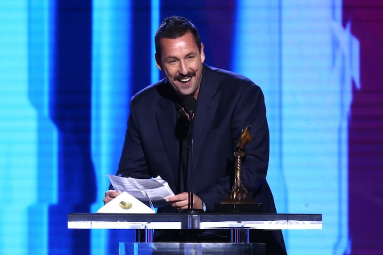 Adam Sandler speaks onstage