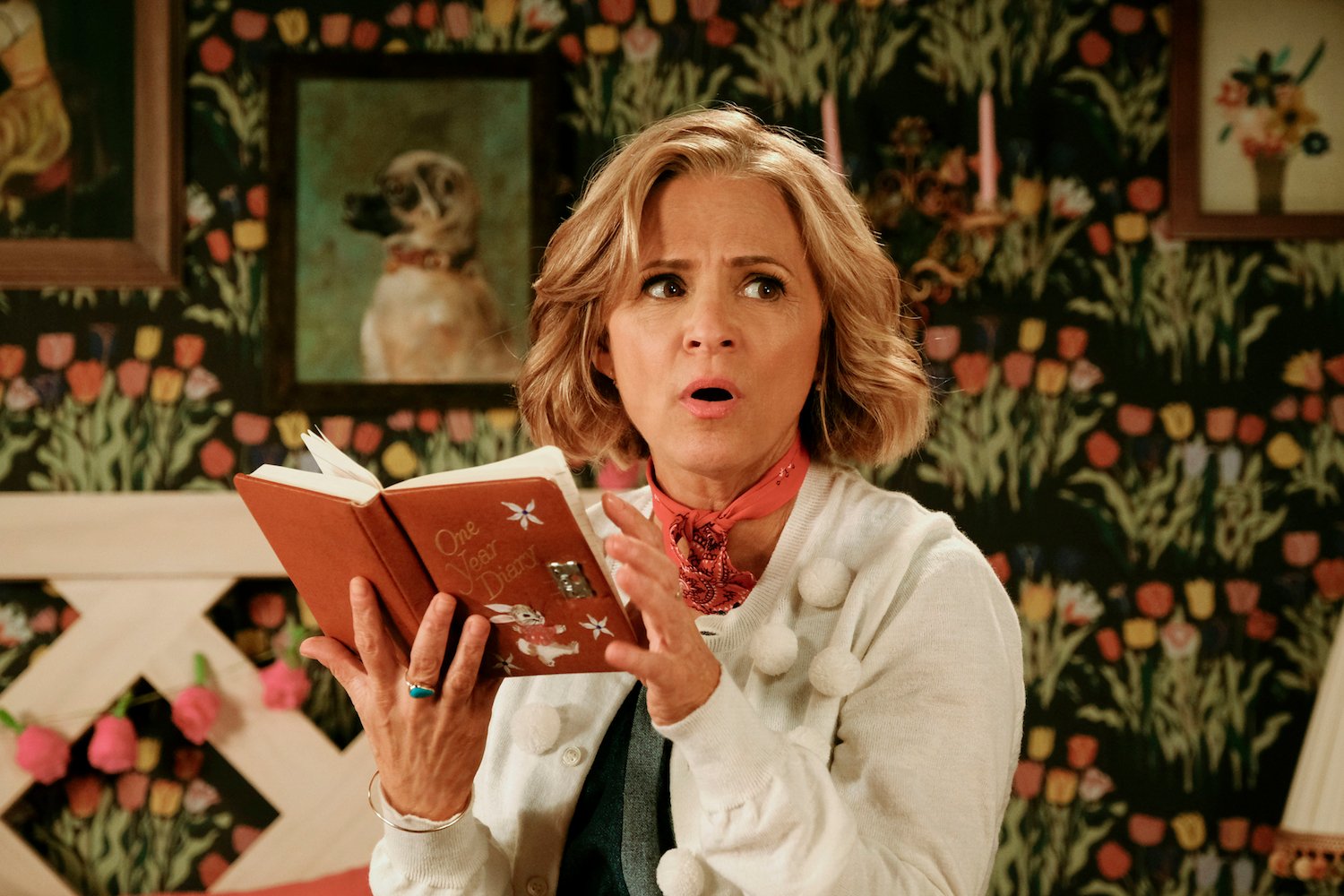 Amy Sedaris reading a book