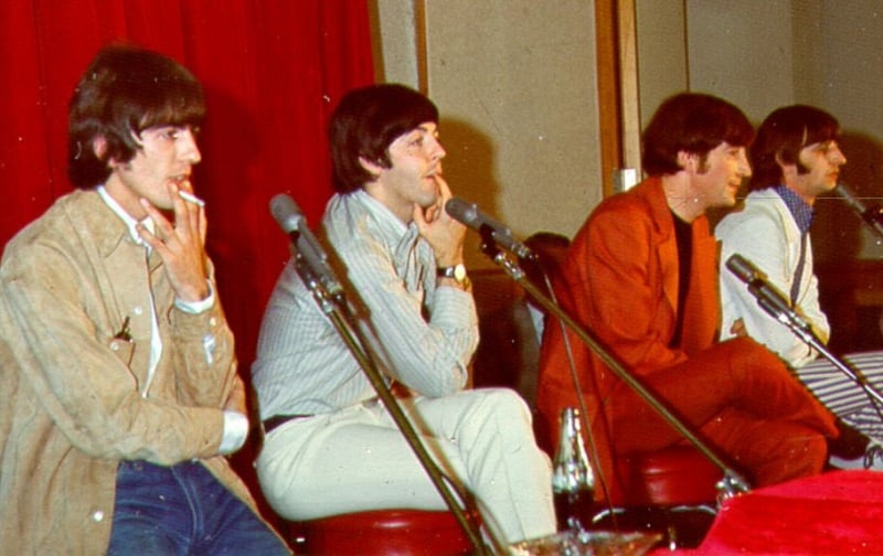 The Beatles sit talking to the press