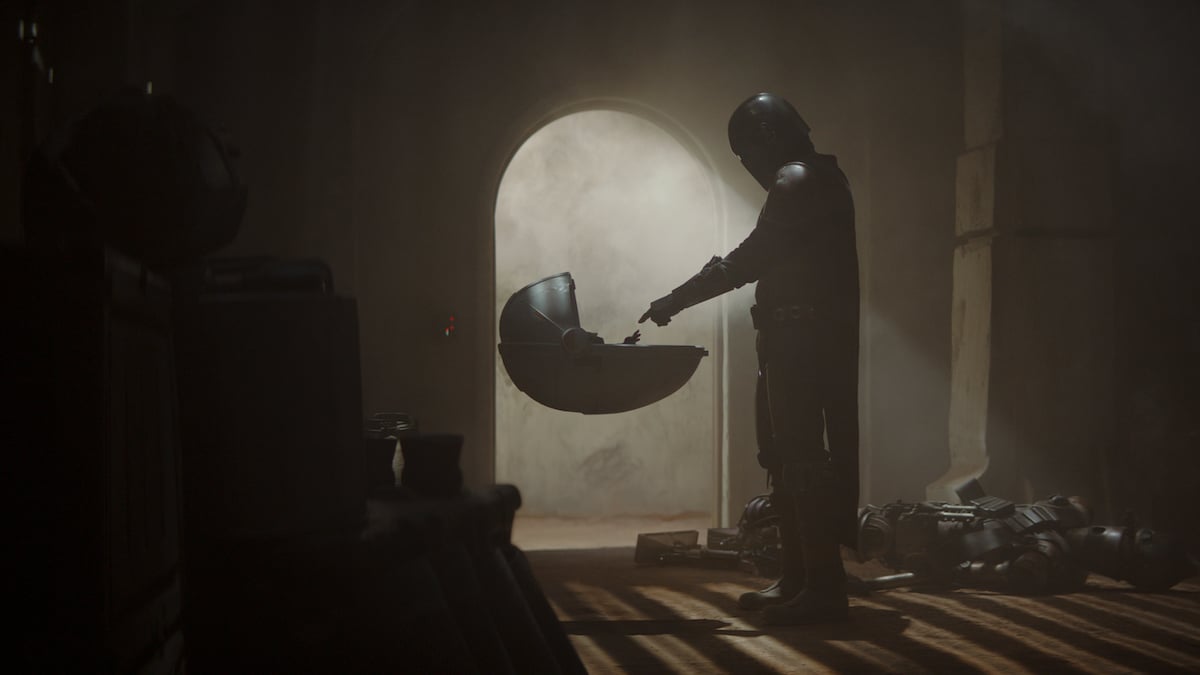The Mandalorian with The Child in the first episode of, 'They Mandalorian.' 