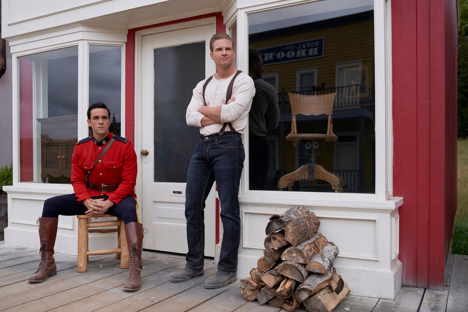 two men in front of building 