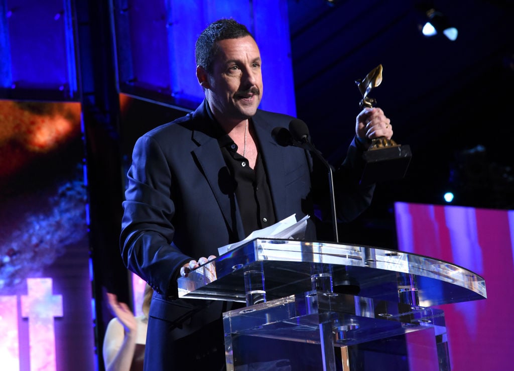 Adam Sandler accepts the Best Male Lead award for 'Uncut Gems' at the Film Independent Spirit Awards