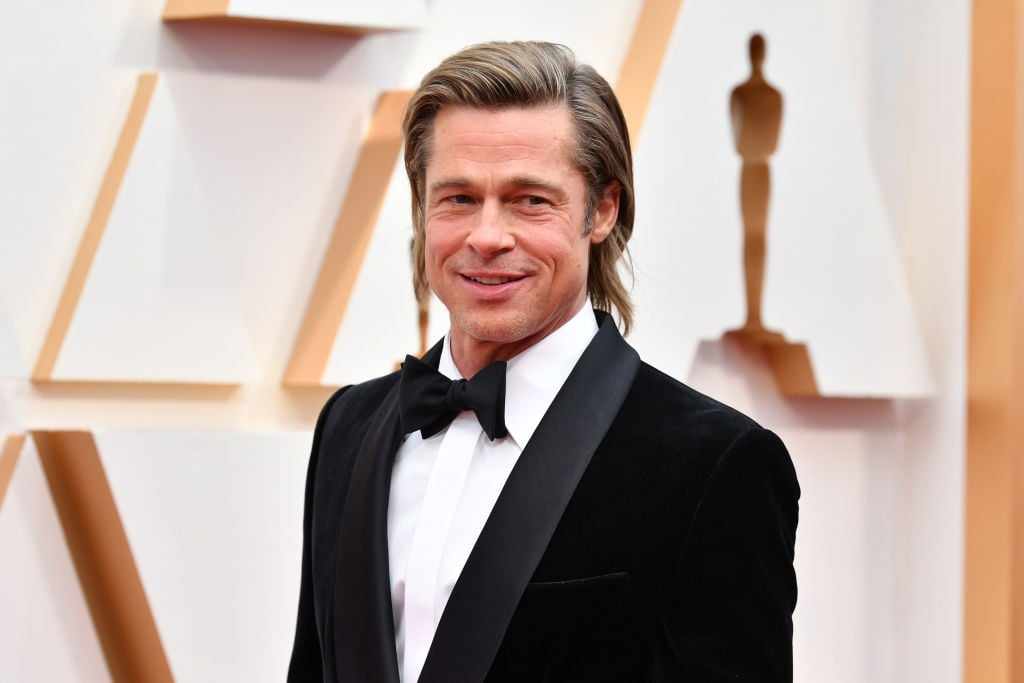 Brad Pitt smiling, turned slightly to the side