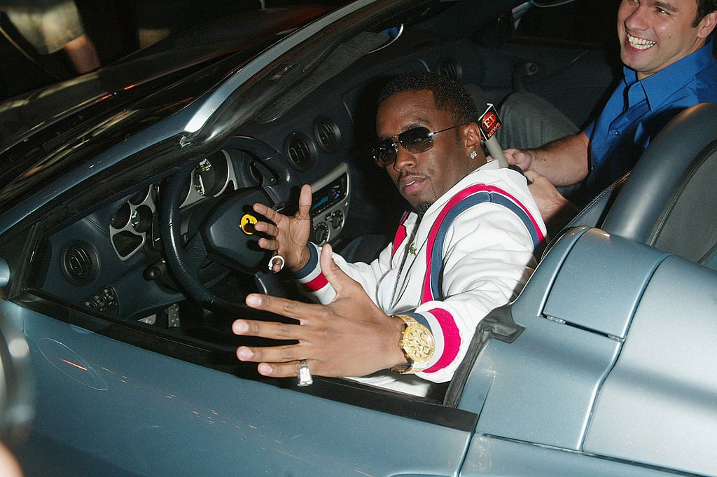 Diddy riding in a convertible