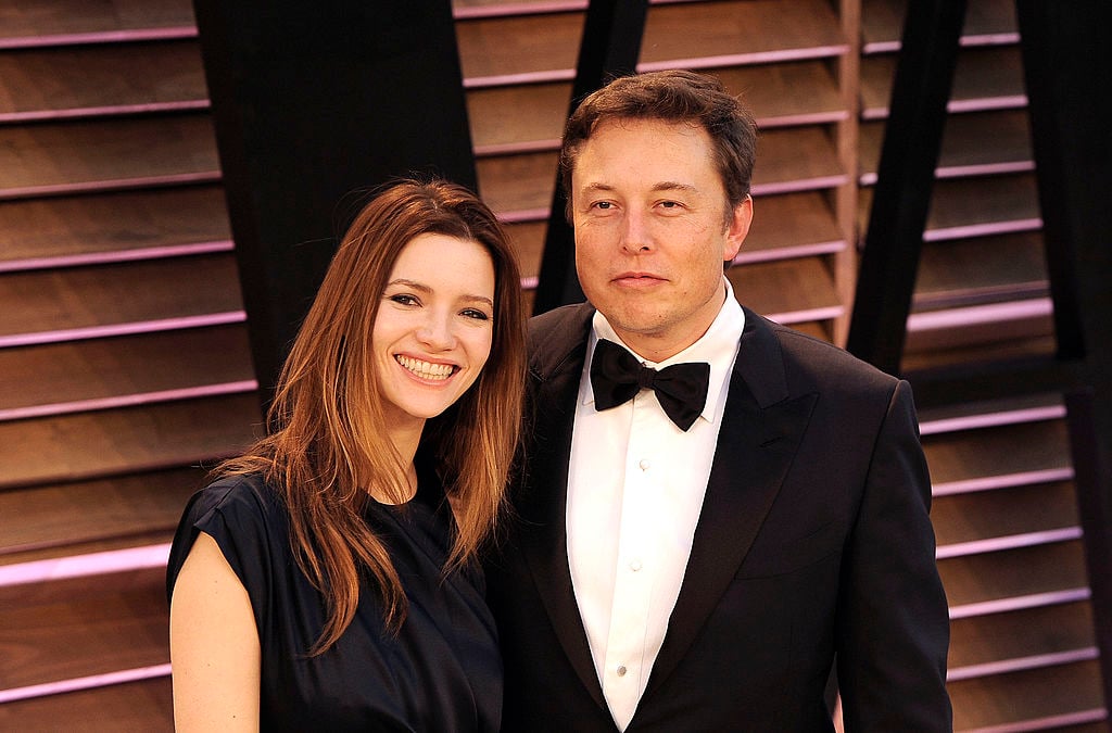 Actress Talulah Riley (L) and Elon Musk arrive to the 2014 Vanity Fair Oscar Party