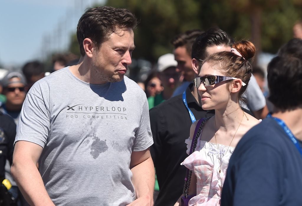 Elon Musk (L) and Canadian musician Grimes (Claire Boucher) attend the 2018 Space X Hyperloop Pod Competition 