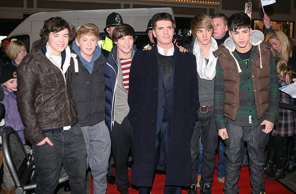 16-year-old Harry Styles with the newly formed One Direction and Simon Cowell in 2010
