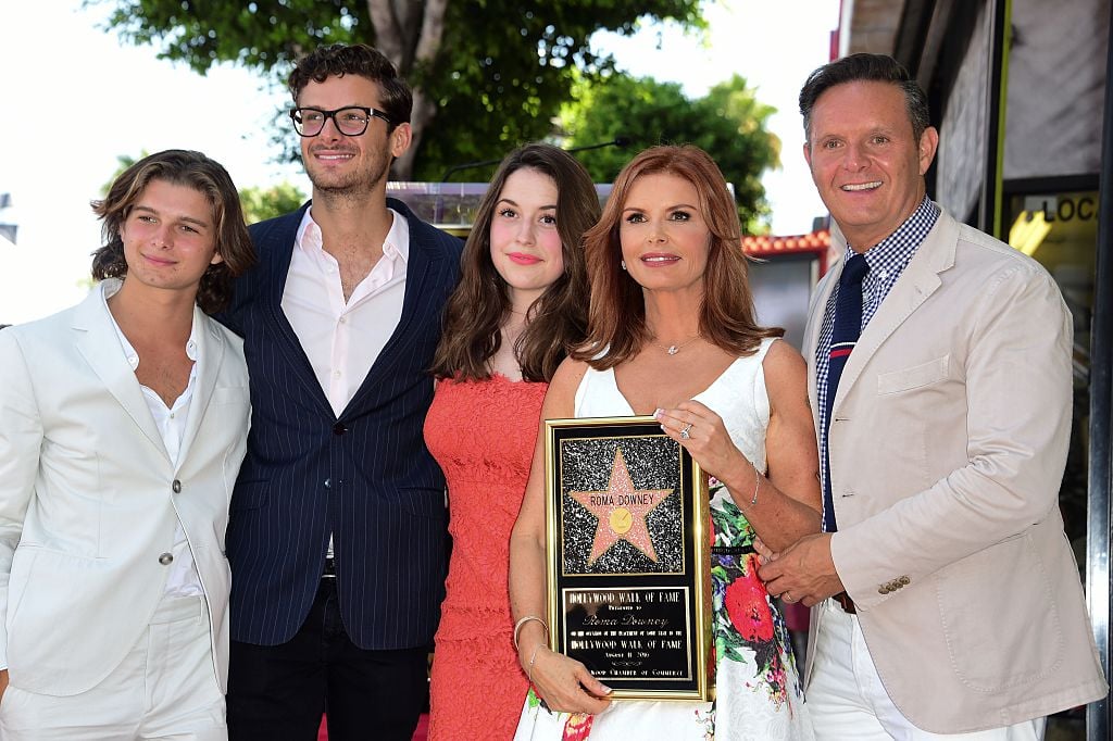 Roma Downey at her 2016 Hollywood Walk of Fame ceremony with from left, her stepsons Cameron Burnett and James Burnett, her daughter Reilly Marie Anspaugh, and Downey's husband Mark Burnett