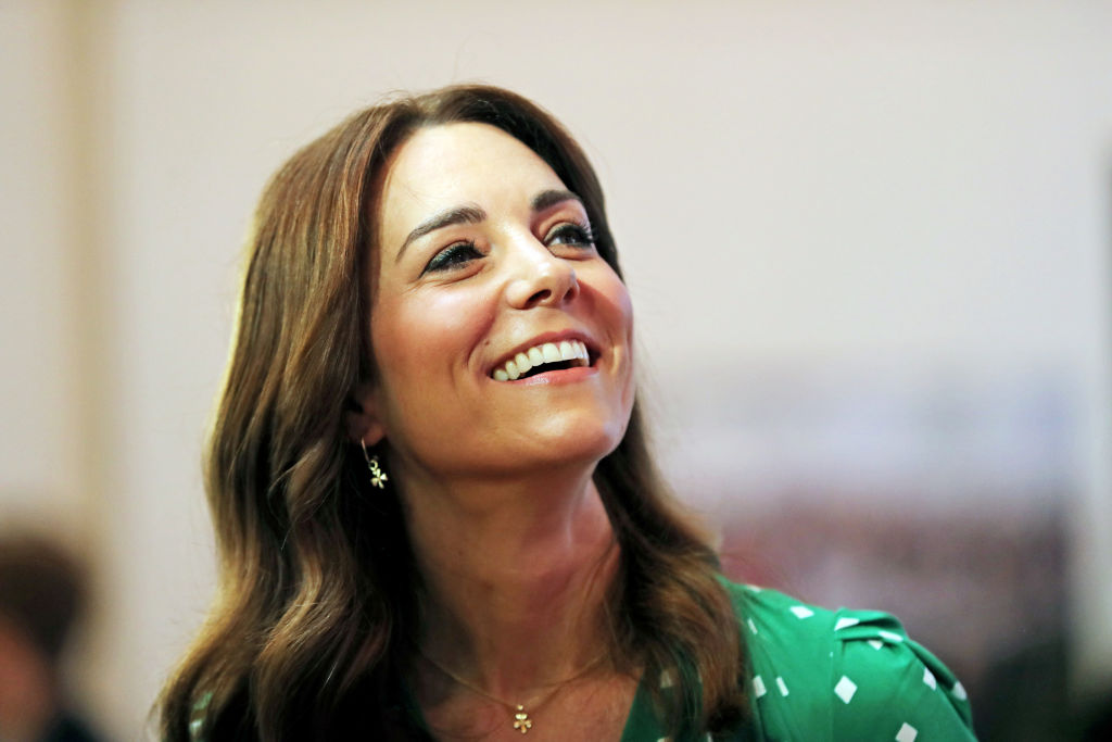 Kate Middleton smiling, looking up and to the right