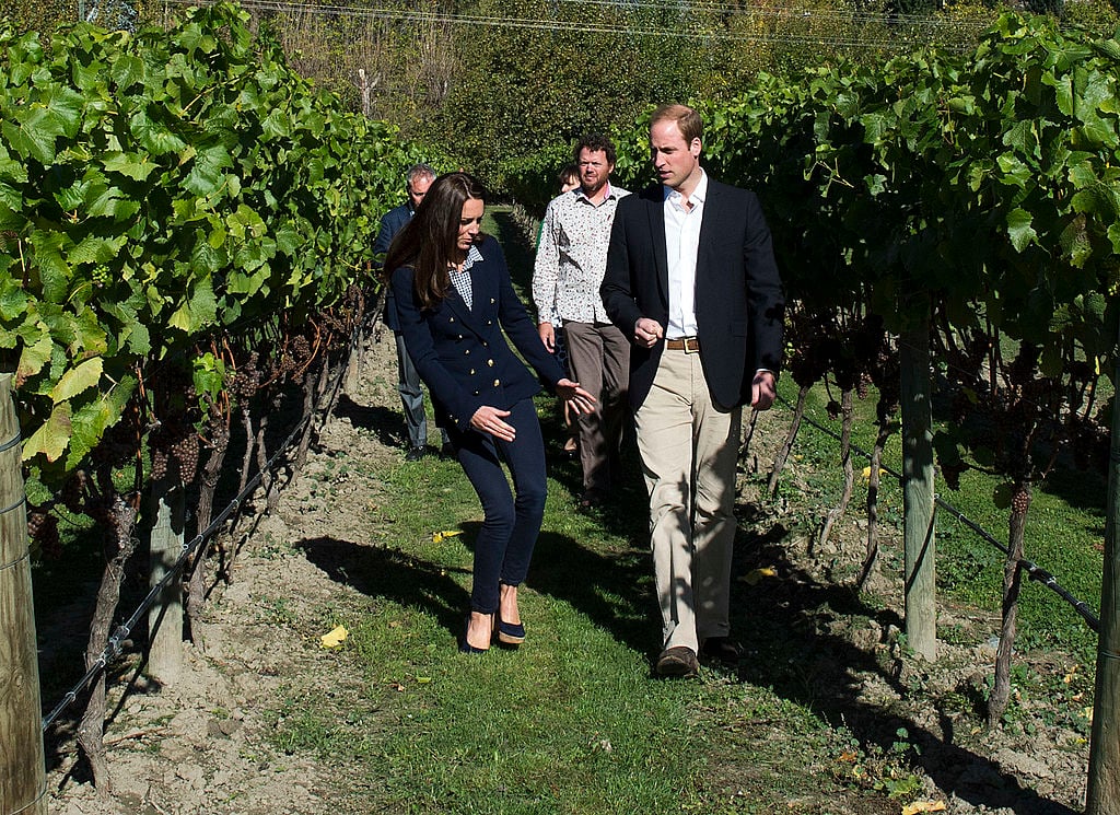 Kate Middleton and Prince William walking through a vineyard