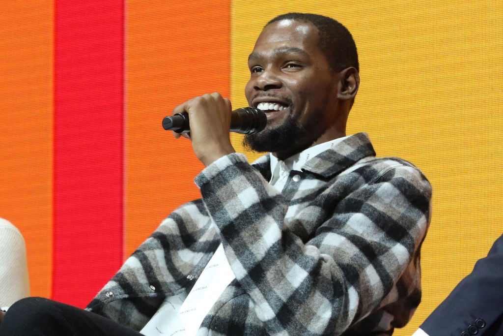 Kevin Durant talking into the microphone during an interview