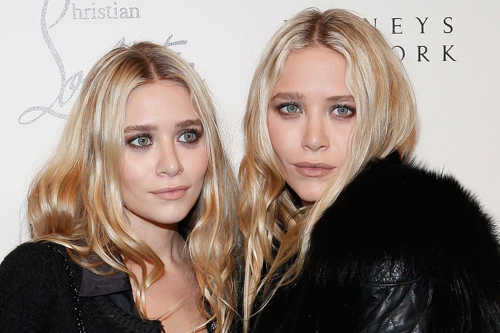 Ashley Olsen and Mary-Kate Olsen attend the Christian Louboutin Cocktail party at Barneys New York on November 1, 2011 in New York City