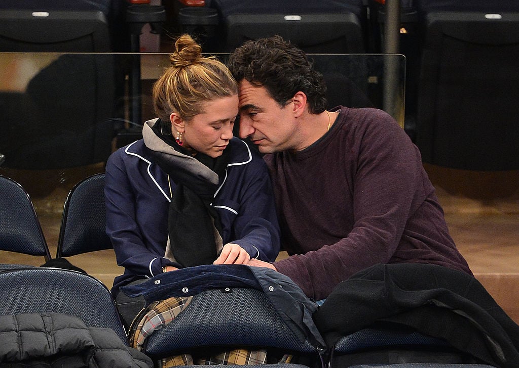Mary-Kate Olsen and Olivier Sarkozy at a basketball game