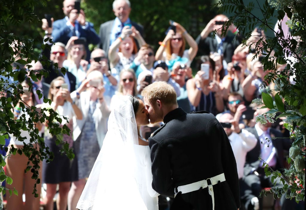 Meghan Markle and Prince Harry kiss as they exit St. George's Chapel after their royal wedding
