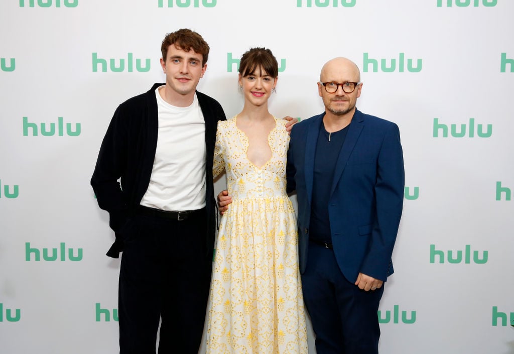(L-R) Paul Mescal, Daisy Edgar-Jones, and Lenny Abrahamson in front of a repeating background with the Hulu logo