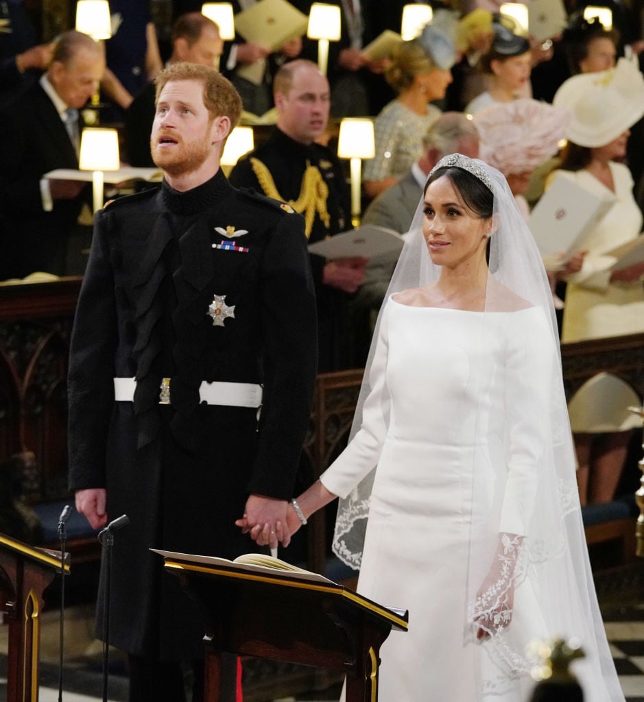 Prince Harry and Meghan Markle hold hands during their royal wedding