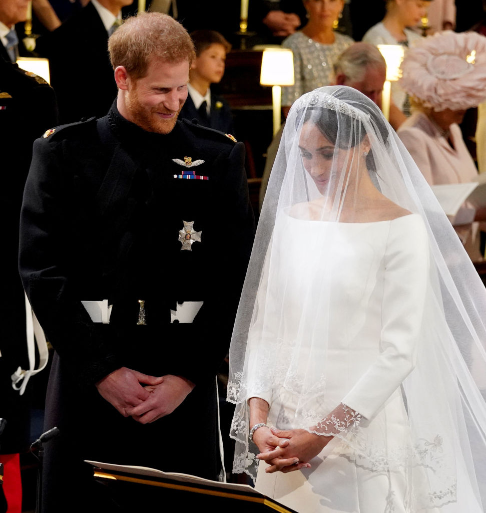 Prince Harry smiles as he looks at Meghan Markle during their royal wedding