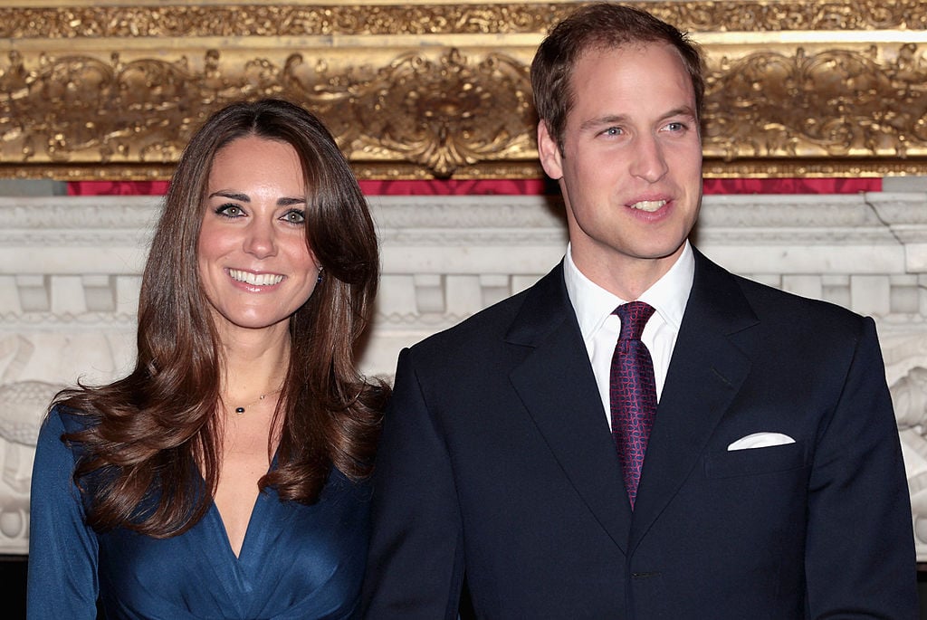 Prince William and Kate Middleton pose for photographs in the State Apartments of St James Palace for engagement photo