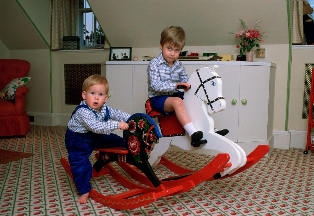 Prince William and Prince William on rocking horses as children