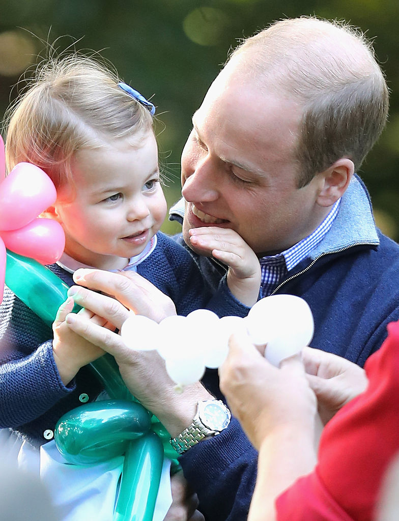 Prince William and Princess Charlotte at a children's party in Canada