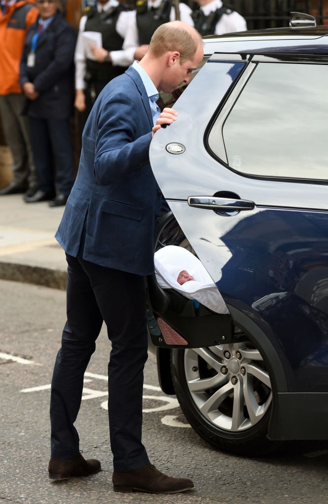 Prince William puts a newborn Prince Louis in the car