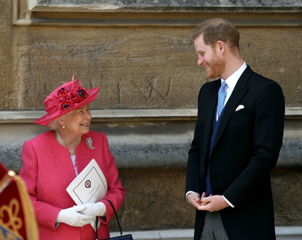 Queen Elizabeth and Prince Harry smile at each other while attending wedding of Lady Gabriella Windsor