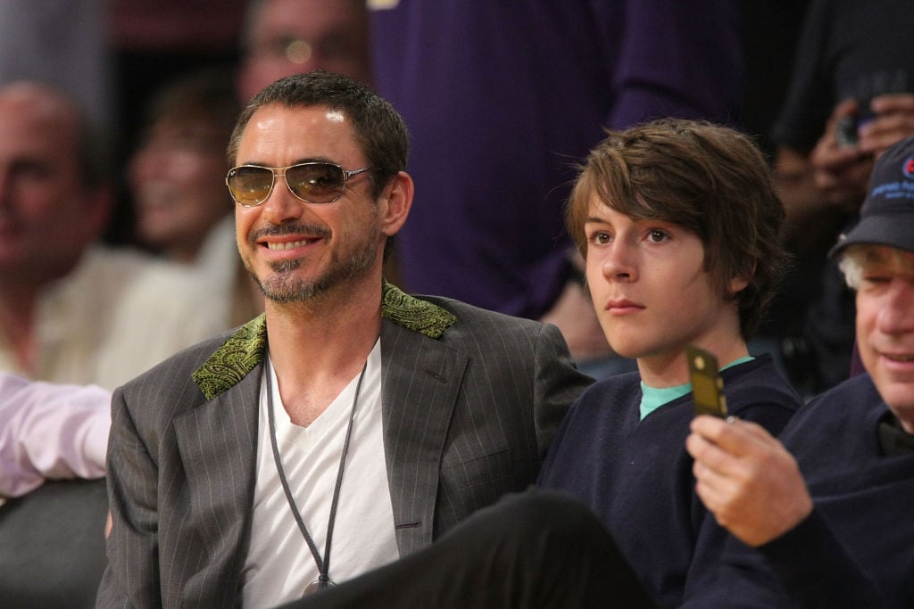 Robert Downey Jr. (L) and his son Indio Downey (R) attend the Los Angeles Lakers against Utah Jazz playoff game