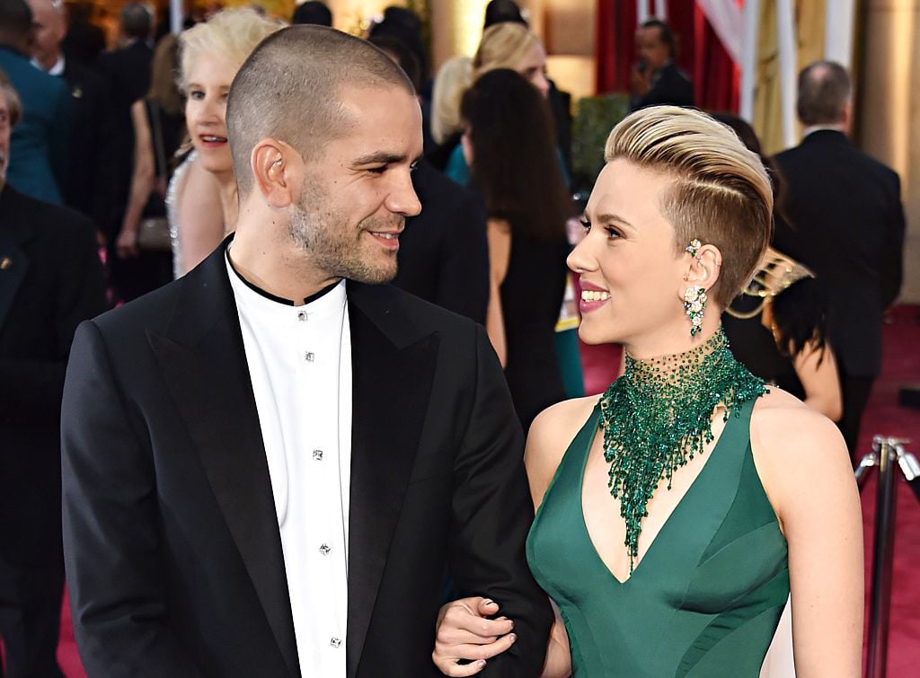 carlett Johansson (R) and  Romain Dauriac pose on the red carpet for the 87th Oscars 