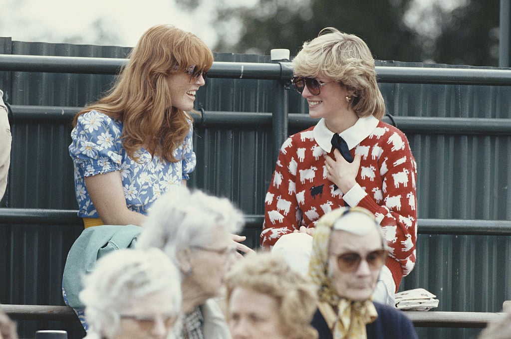 Diana, Princess of Wales (1961 - 1997) with Sarah Ferguson at the Guard's Polo Club, Windsor, June 1983. The Princess is wearing a jumper with a sheep motif from the London shop, Warm And Wonderful