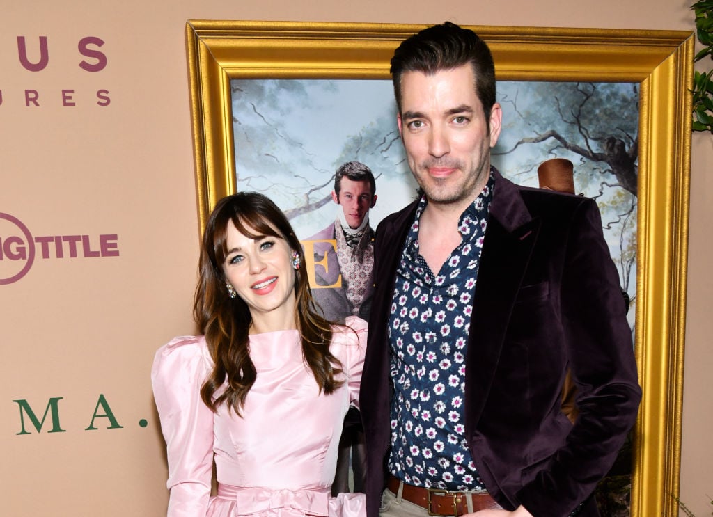 Zooey Deschanel and Jonathan Scott smiling at the camera